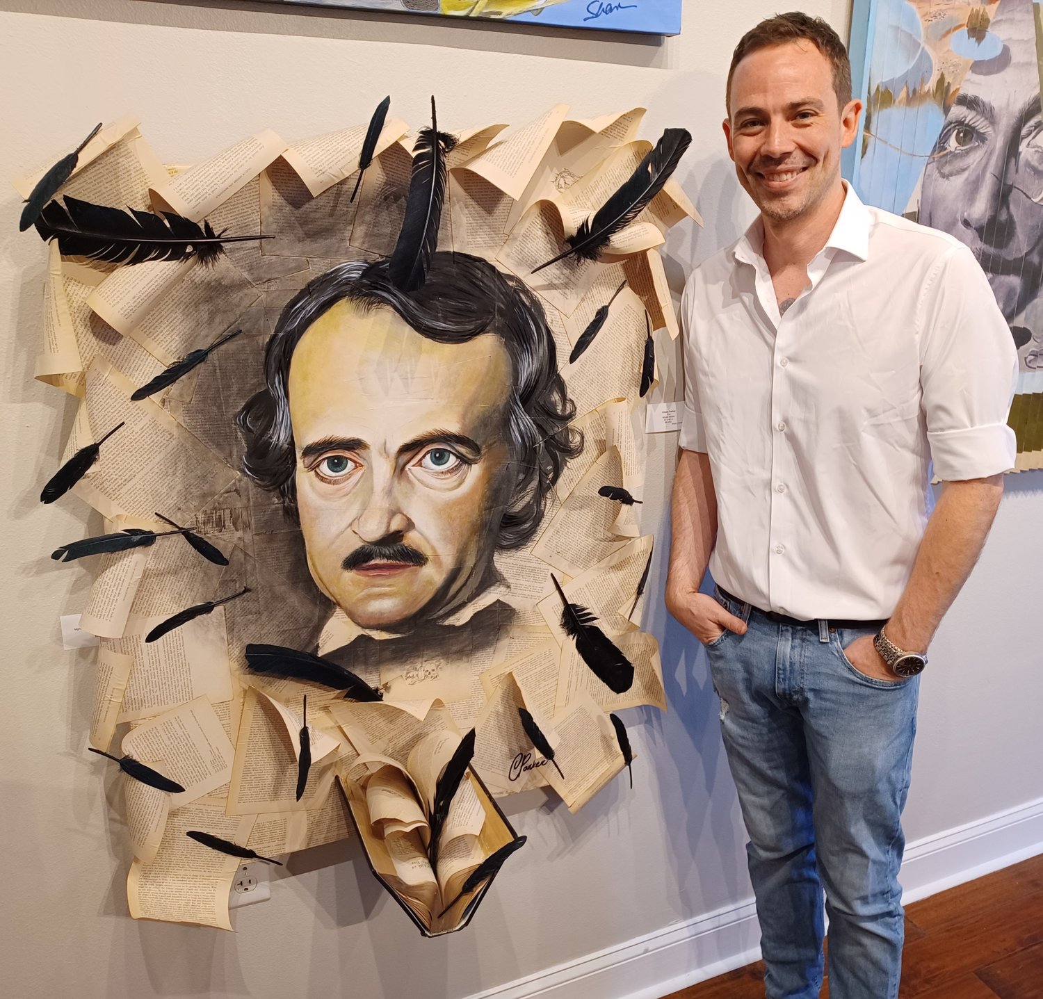 Artist Chase Parker with his eye-catching work, “Poe,” at the Grand Bohemian Gallery in St. Augustine.